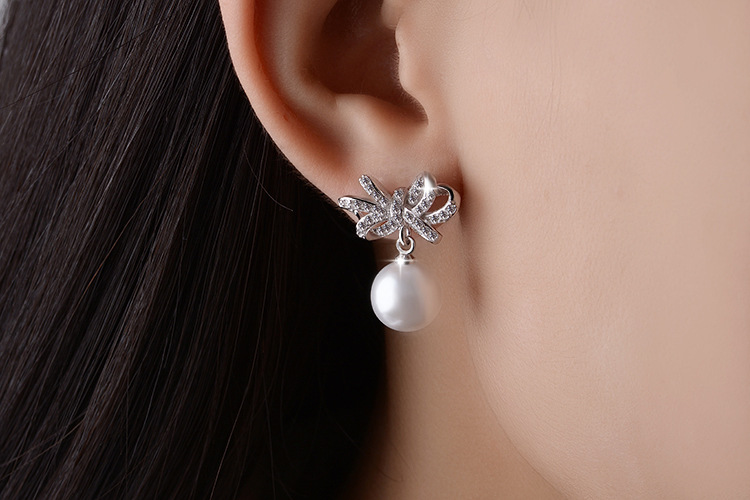 1 Pair Cute Sweet Bow Knot Plating Inlay Copper Pearl Zircon White Gold Plated Drop Earrings display picture 1