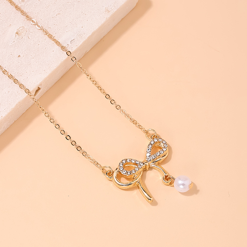Style Ig Sucré Noeud D'arc Alliage Perle Incruster Strass Femmes Collier display picture 3