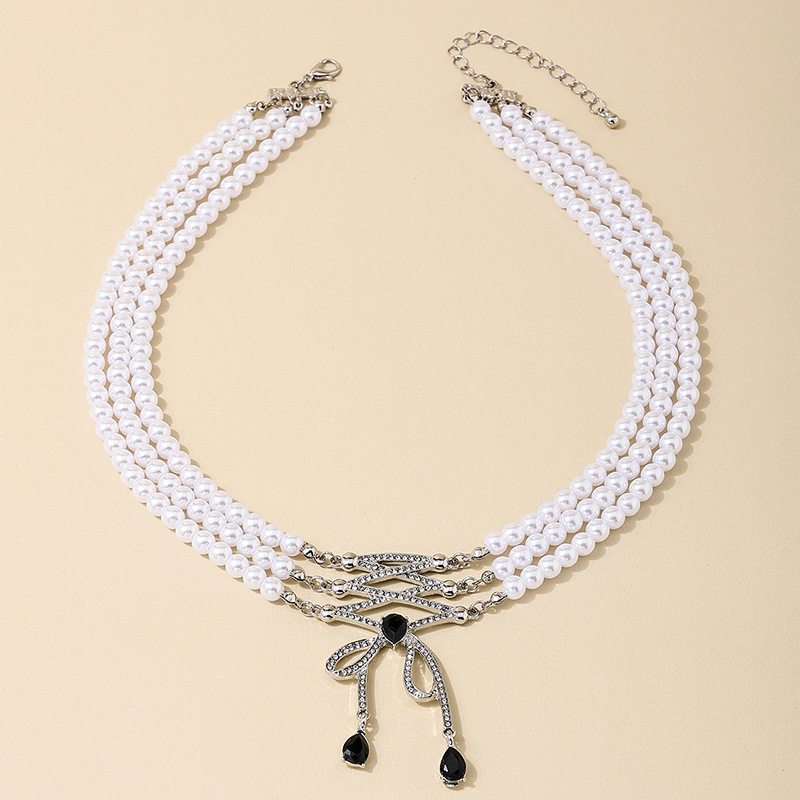 Casual Simple Style Bow Knot Imitation Pearl Alloy Beaded Inlay Rhinestones Women's Three Layer Necklace display picture 3