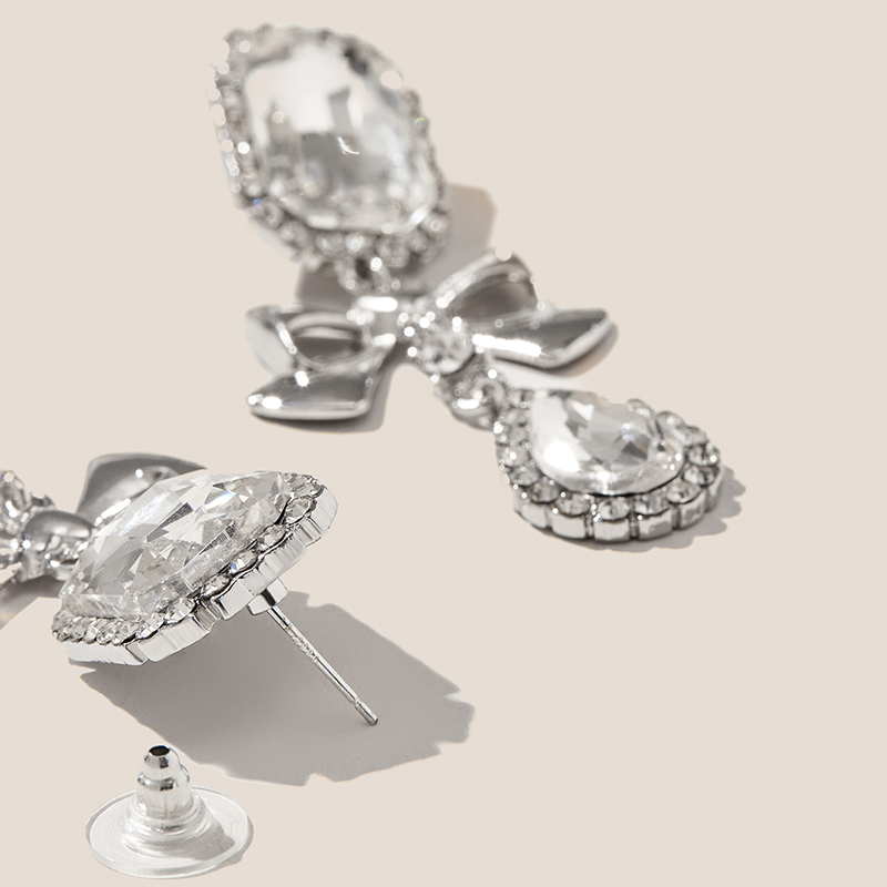 1 Par Elegante Estilo Simple Nudo De Lazo Embutido Aleación Diamantes De Imitación Artificiales Pendientes De Gota display picture 1