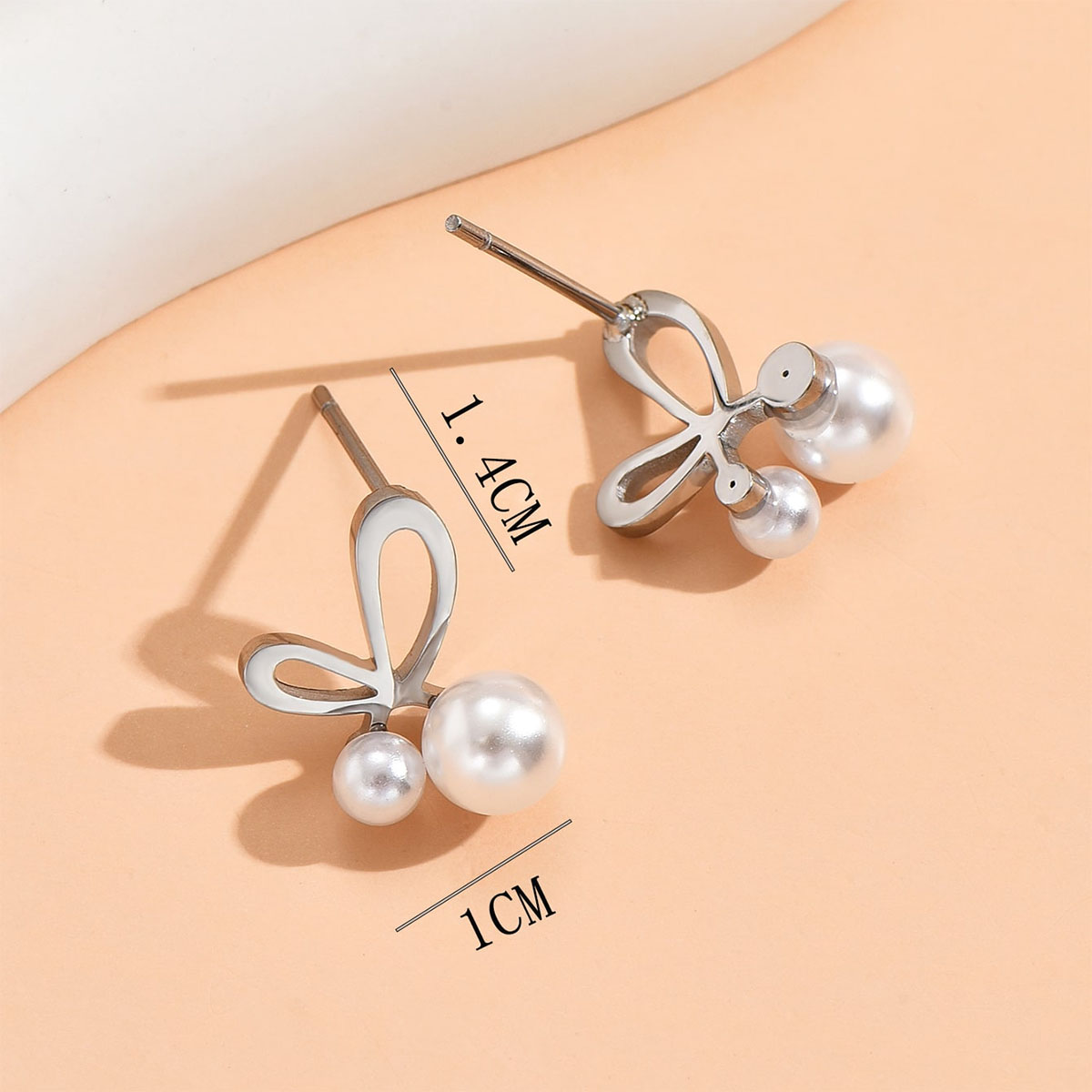 Simple Style Butterfly Stainless Steel Inlay Artificial Pearls Earrings 1 Pair display picture 3