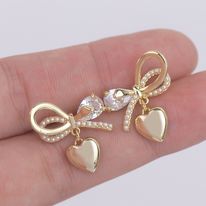 1 Pair Fairy Style French Style Simple Style Heart Shape Bow Knot Plating Inlay Copper Artificial Pearls Zircon 14k Gold Plated Ear Studs display picture 3