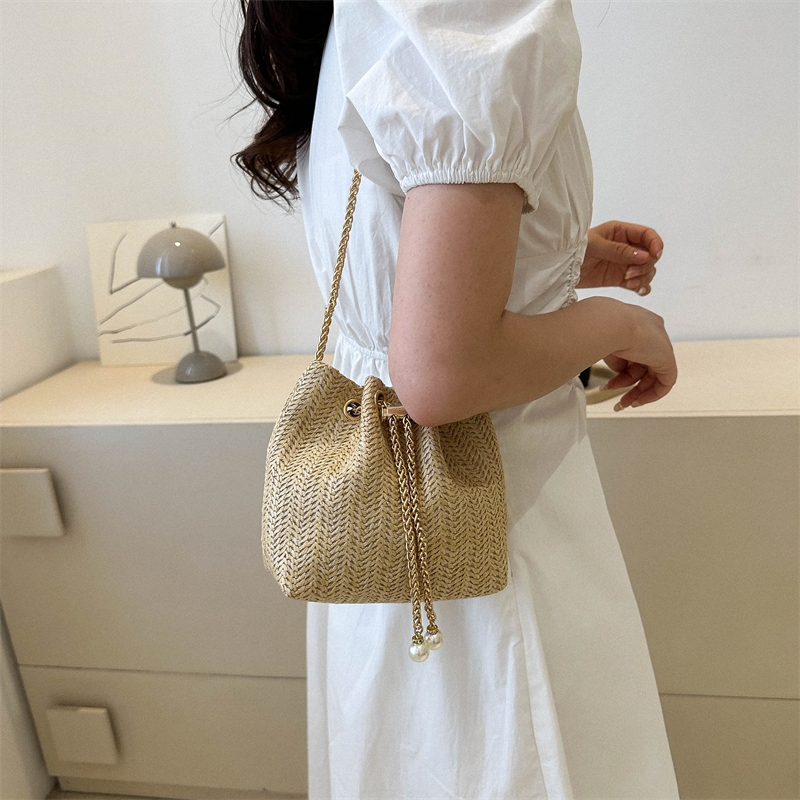 Women's Canvas Straw Solid Color Streetwear Bucket String Bucket Bag display picture 1