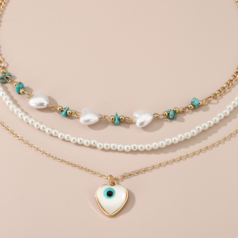 Simple Style Devil's Eye Heart Shape Turquoise Imitation Pearl Alloy Metal Wholesale Necklace display picture 1
