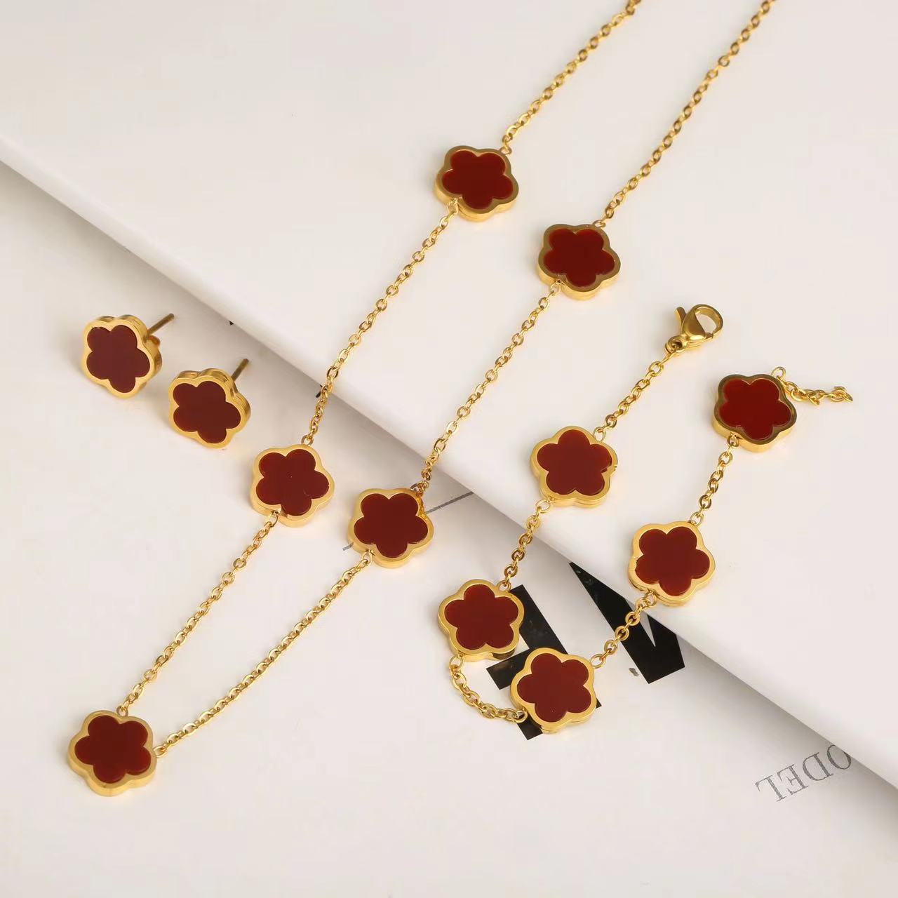 Titan Stahl 18 Karat Vergoldet Einfacher Stil Strassenmode Blütenblatt Acryl Armbänder Ohrringe Halskette display picture 1