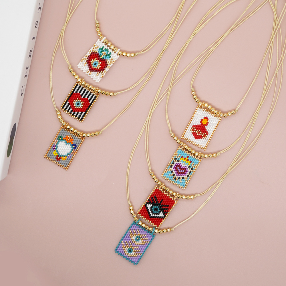 Bohemian Peach Heart Shape Crown Organic Glass Unisex Necklace Pendant display picture 1