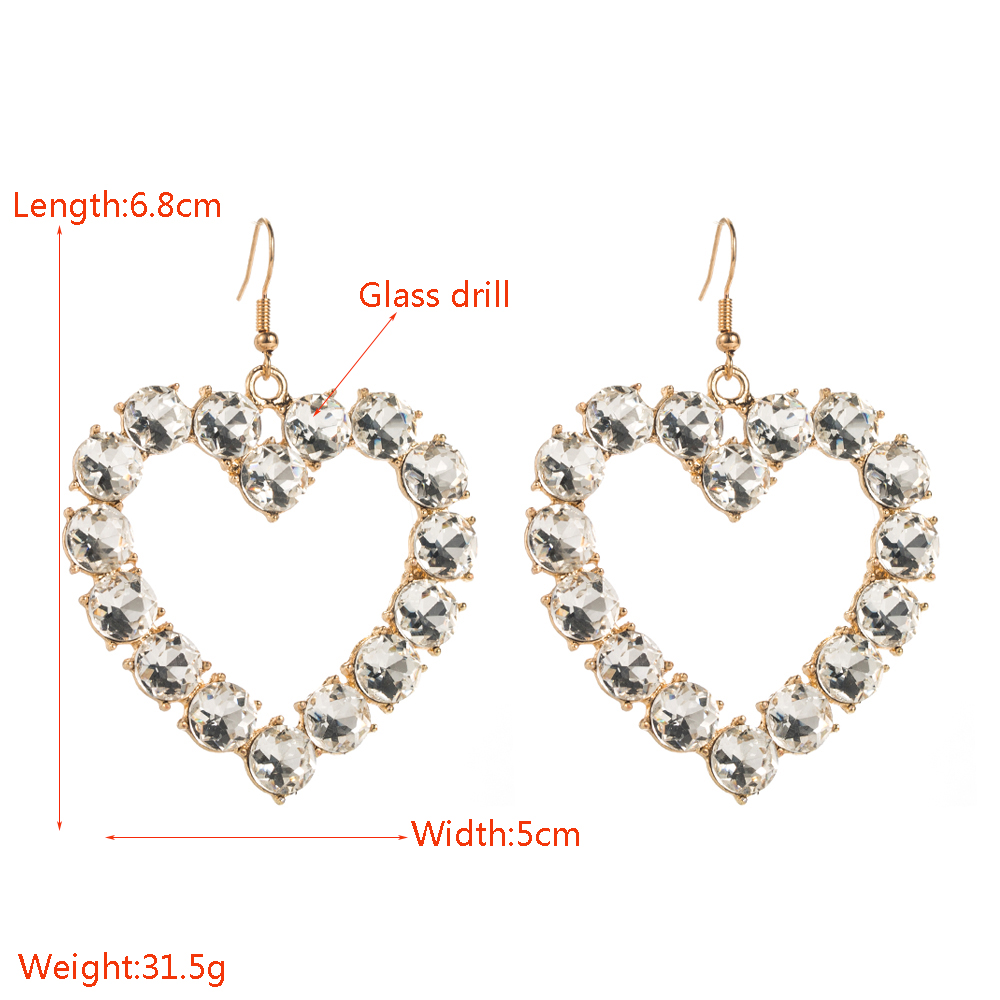 1 Pair Vacation Simple Style Classic Style Heart Shape Hollow Out Inlay Alloy Glass Gold Plated Drop Earrings display picture 1