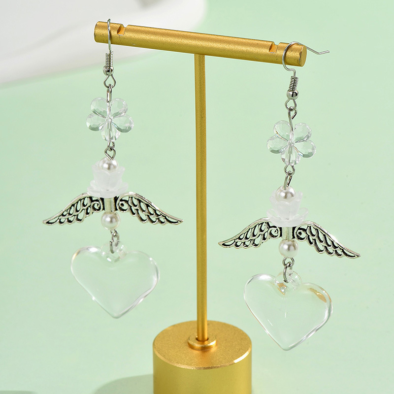 1 Pair Casual Simple Style Heart Shape Wings Flower Plating Hollow Out Arylic Drop Earrings display picture 3