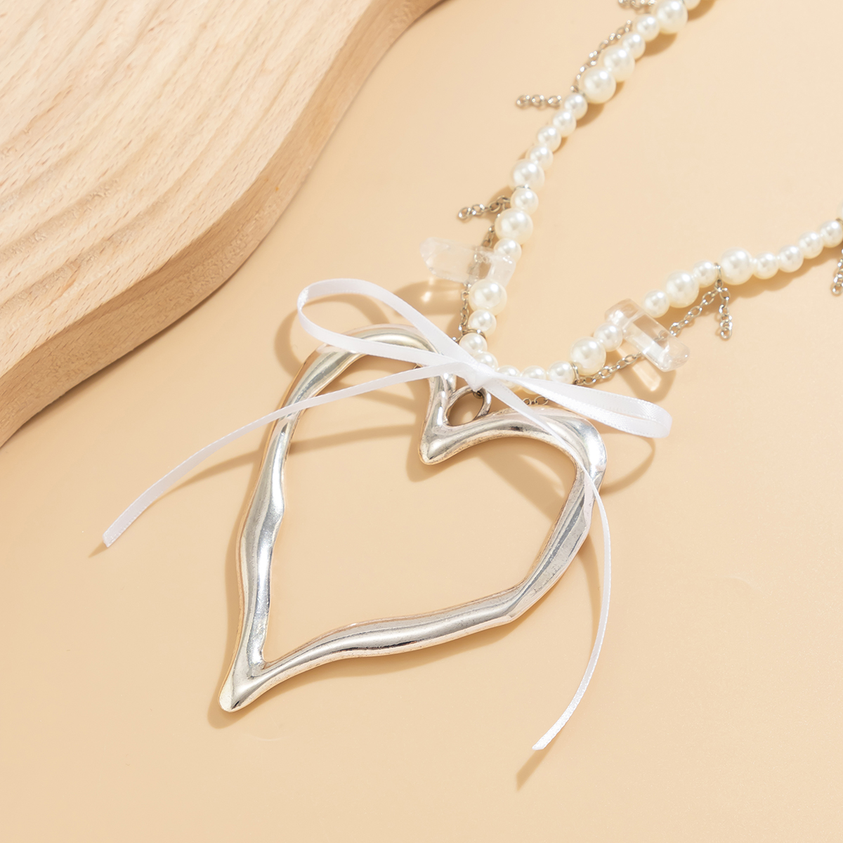 IG-Stil Elegant Herzform Bogenknoten Imitationsperle Legierung Perlen Frau display picture 5