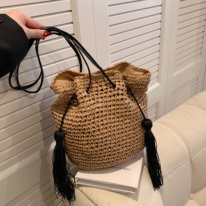 Women's Straw Solid Color Vacation Tassel Bucket String Straw Bag display picture 8