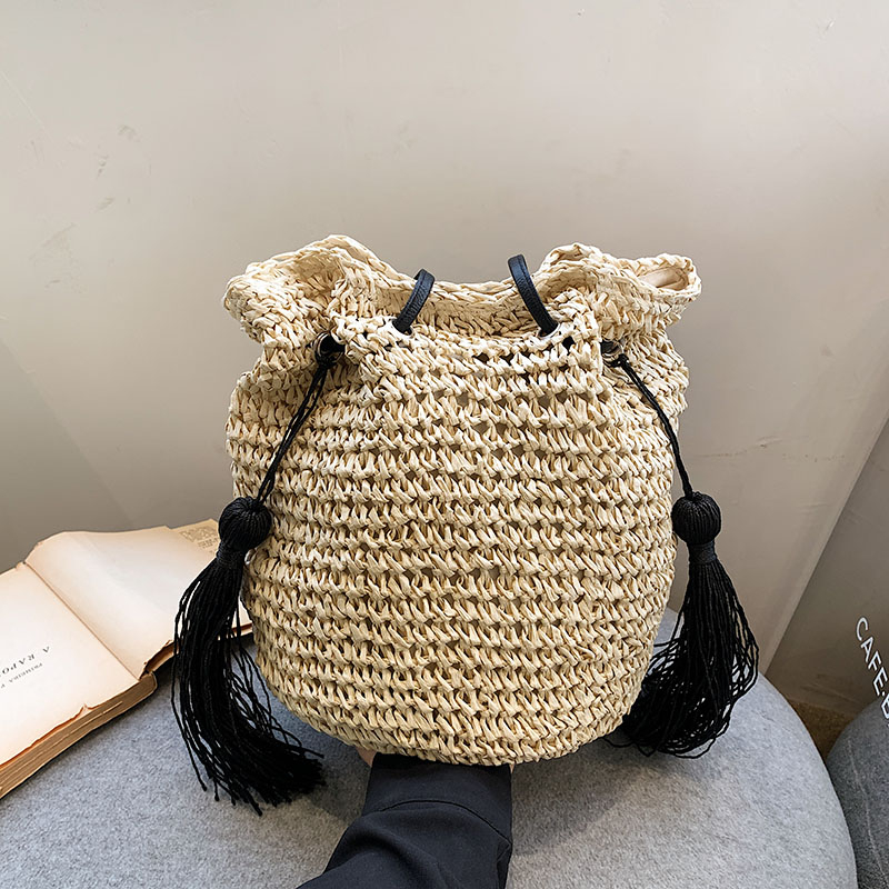Women's Straw Solid Color Vacation Tassel Bucket String Straw Bag display picture 7