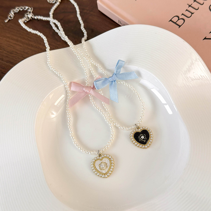 Elegant Glam Sweet Heart Shape Flower Bow Knot Imitation Pearl Alloy Beaded Inlay Rhinestones Pearl Women's Pendant Necklace display picture 5