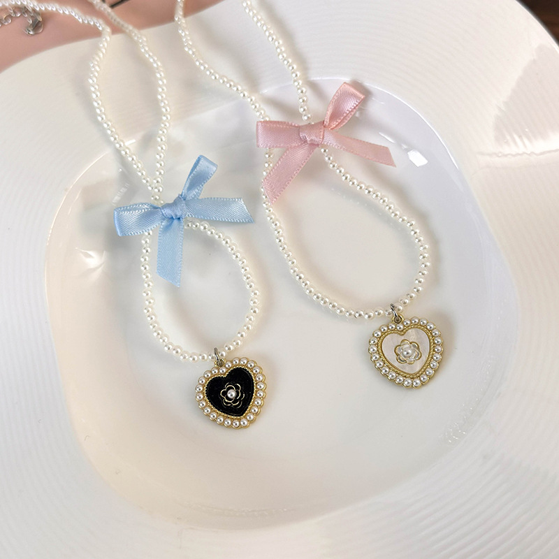 Elegant Glam Sweet Heart Shape Flower Bow Knot Imitation Pearl Alloy Beaded Inlay Rhinestones Pearl Women's Pendant Necklace display picture 7