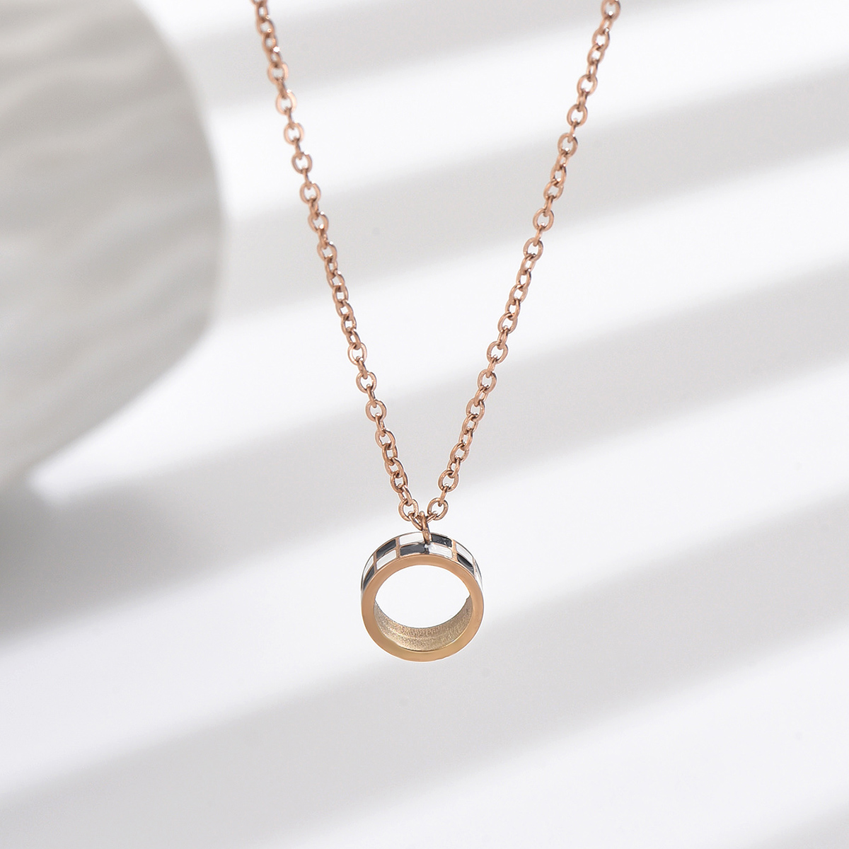 304 Stainless Steel Rose Gold Plated Casual Simple Style Enamel Plating Hollow Out Round Lattice Pendant Necklace display picture 1