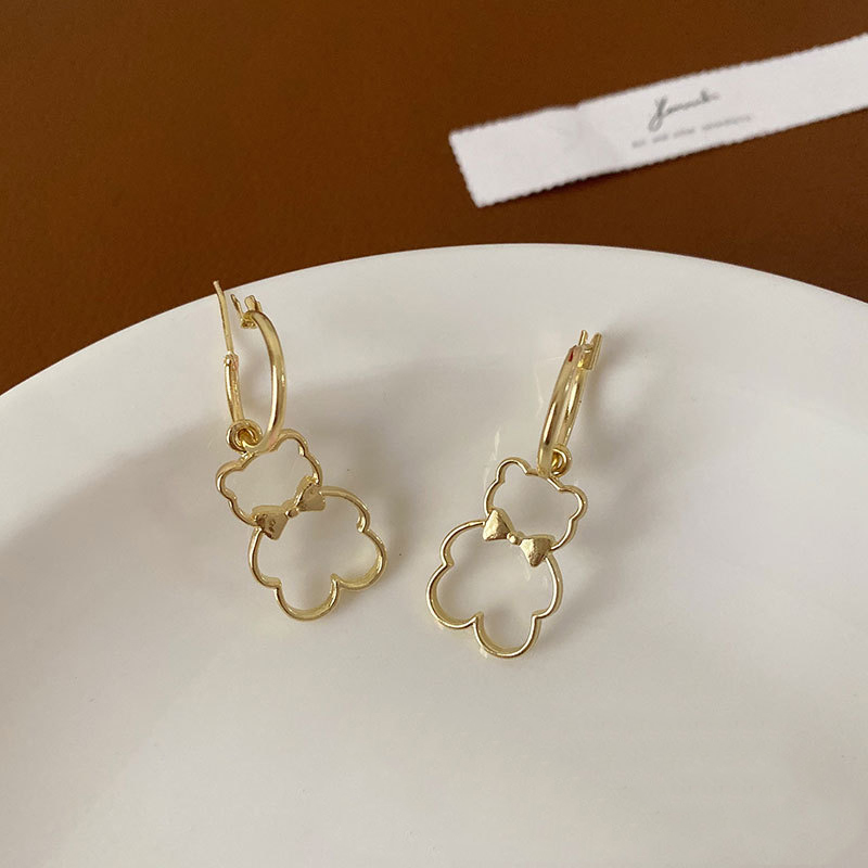 Korean Style Cute Bear Bow Hollow Earrings display picture 1