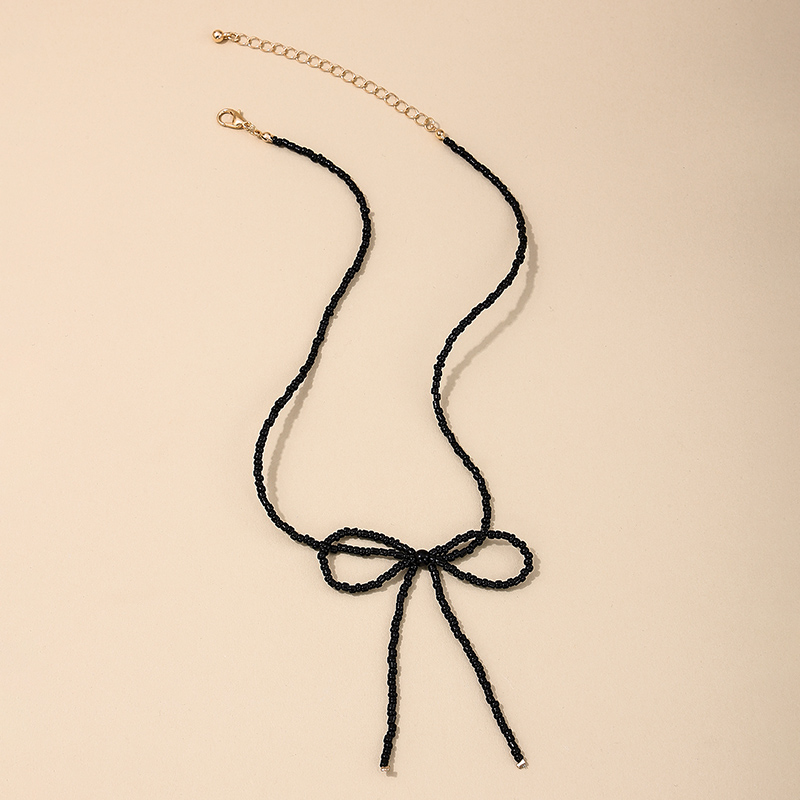 Großhandel Schmuck Einfacher Stil Klassischer Stil Bogenknoten Glas Glas Perlen Halskette Mit Anhänger display picture 1