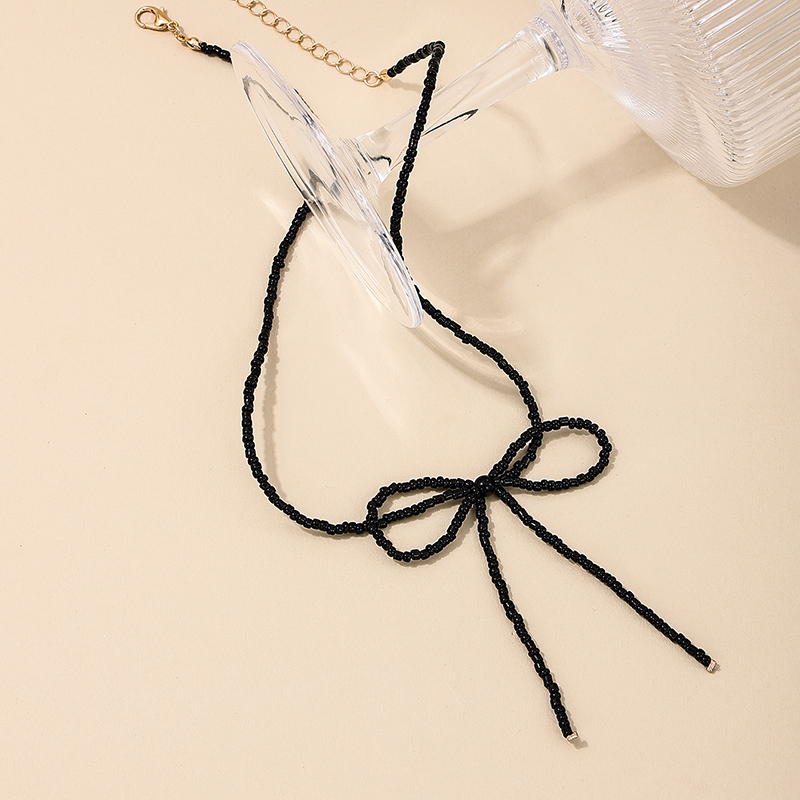Großhandel Schmuck Einfacher Stil Klassischer Stil Bogenknoten Glas Glas Perlen Halskette Mit Anhänger display picture 3