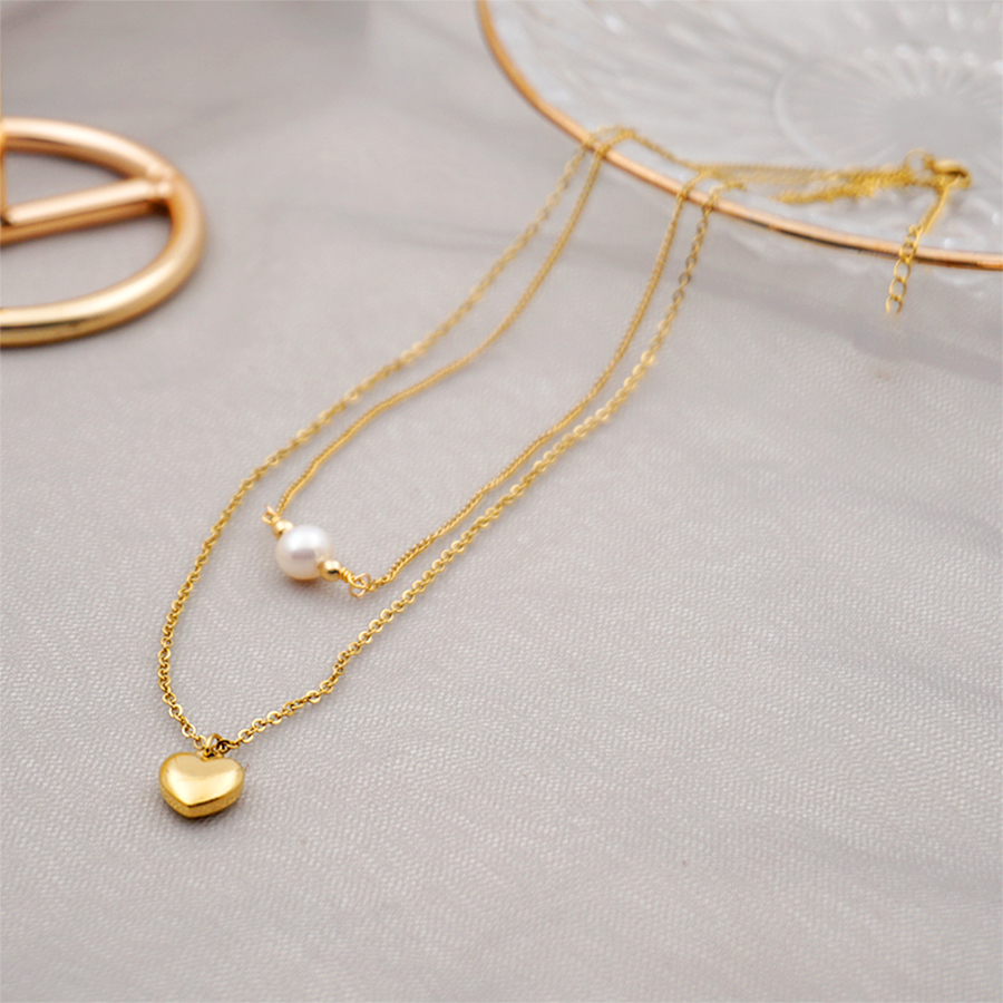 304 Stainless Steel Titanium Steel Gold Plated Simple Style Inlay Heart Shape Artificial Pearls Double Layer Necklaces Sweater Chain display picture 1