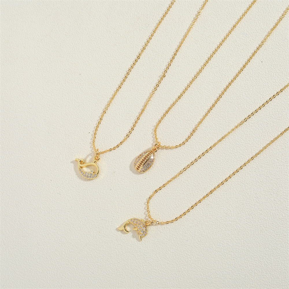 Copper 14K Gold Plated Vintage Style Simple Style Commute Hollow Out Inlay Round Starfish Dolphin Zircon Pendant Necklace display picture 1