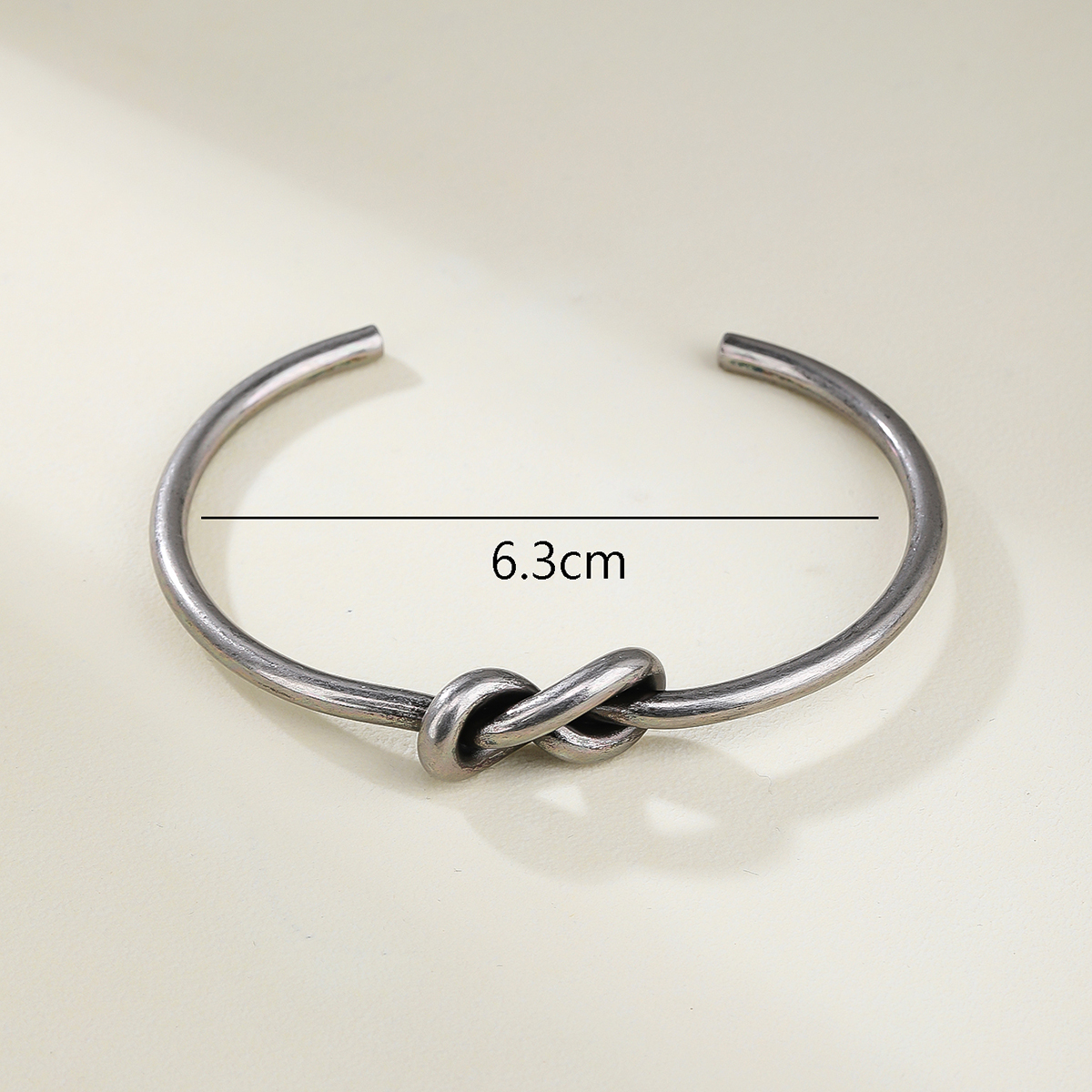 Stainless Steel 14K Gold Plated Vintage Style Simple Style Solid Color Knot Bangle display picture 4