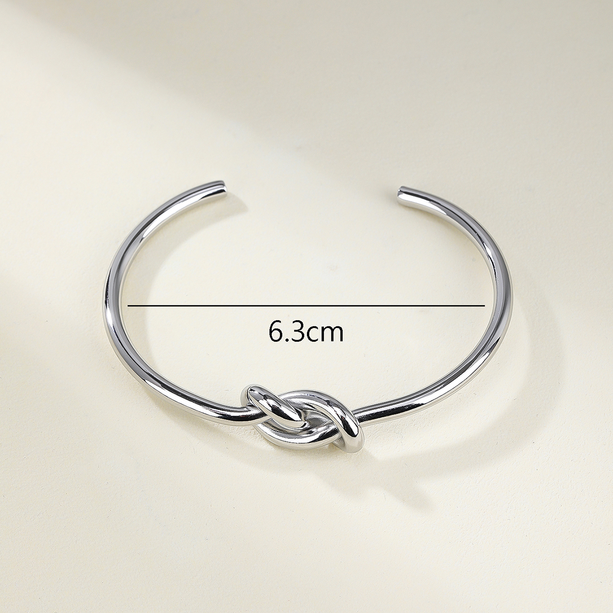 Stainless Steel 14K Gold Plated Vintage Style Simple Style Solid Color Knot Bangle display picture 6