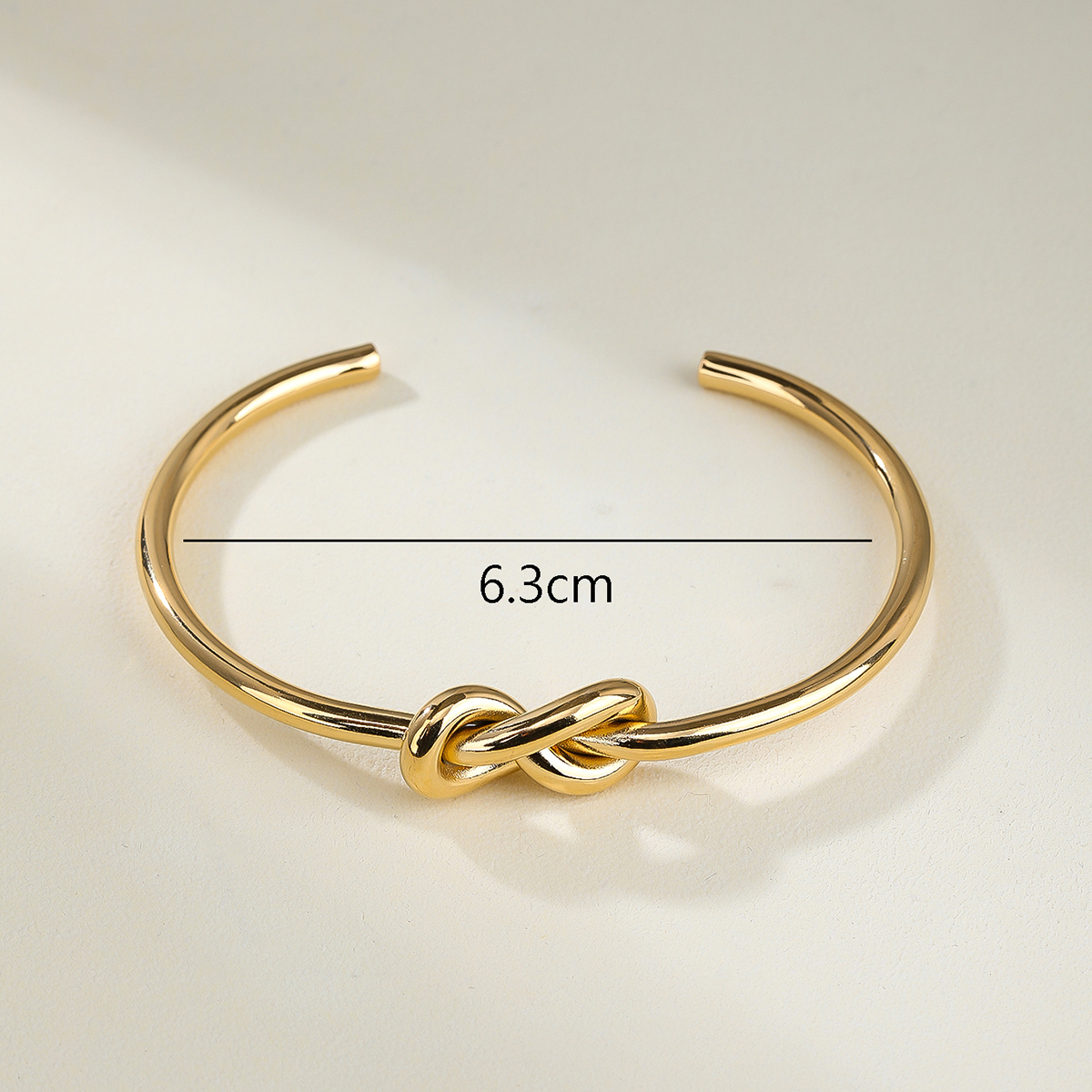 Stainless Steel 14K Gold Plated Vintage Style Simple Style Solid Color Knot Bangle display picture 5