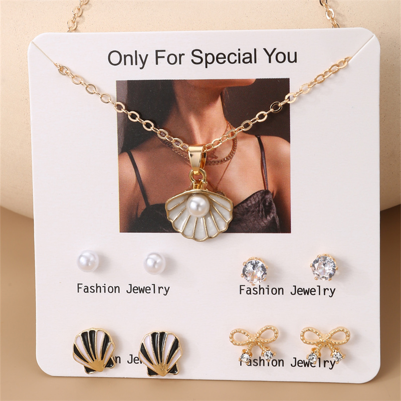 IG Style Modern Style Simple Style Fruit Heart Shape Bow Knot Alloy Inlay Artificial Pearls Rhinestones Women's Earrings Necklace display picture 2