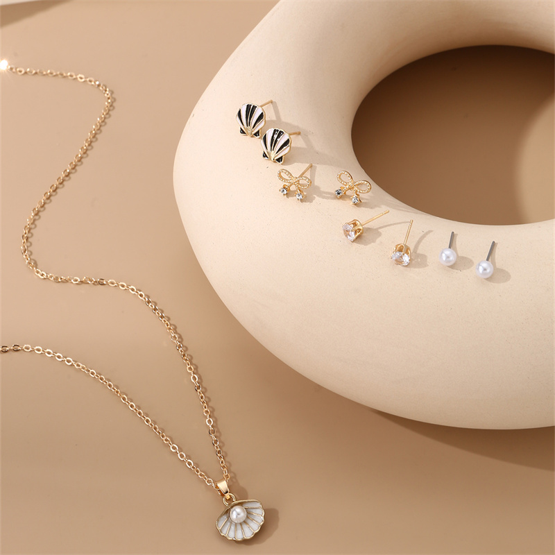 IG Style Modern Style Simple Style Fruit Heart Shape Bow Knot Alloy Inlay Artificial Pearls Rhinestones Women's Earrings Necklace display picture 3