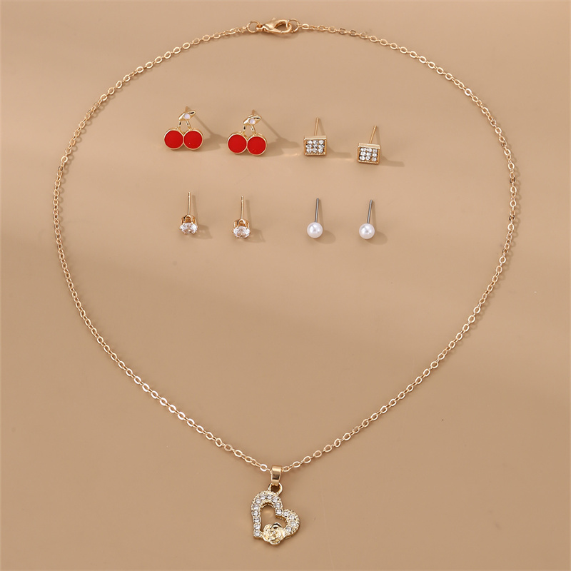 IG Style Modern Style Simple Style Fruit Heart Shape Bow Knot Alloy Inlay Artificial Pearls Rhinestones Women's Earrings Necklace display picture 7