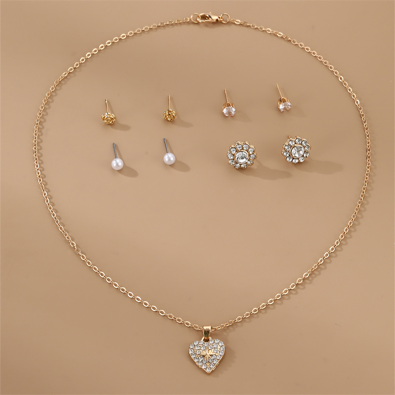 Estilo IG Estilo Moderno Estilo Simple Fruta Forma De Corazón Nudo De Lazo Aleación Embutido Perlas Artificiales Diamantes De Imitación Mujeres Aretes Collar display picture 30