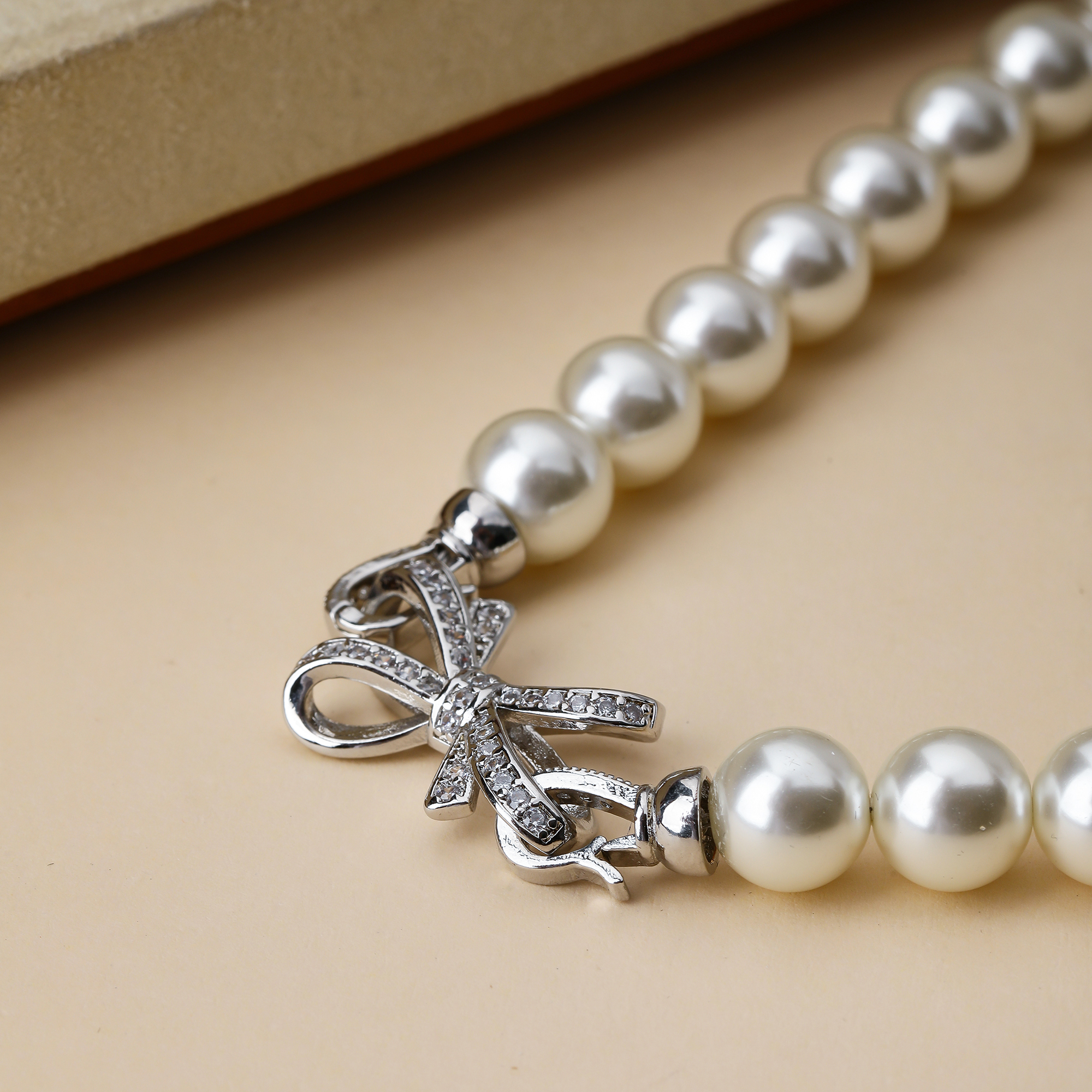 Großhandel Schmuck Elegant Glam Bogenknoten Künstliche Perle Kupfer Zirkon Inlay Halskette display picture 1