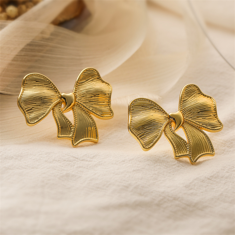 1 Pair Elegant Streetwear Bow Knot Plating Copper Ear Studs display picture 3
