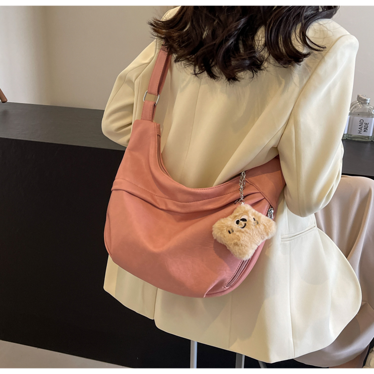 Women's Medium Pu Leather Solid Color Classic Style Sewing Thread Dumpling Shape Zipper Crossbody Bag display picture 13