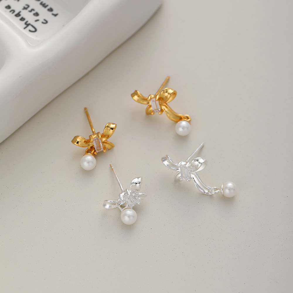 1 Pair Sweet Simple Style Bow Knot Hollow Out Inlay Sterling Silver Pearl Zircon Ear Studs display picture 2