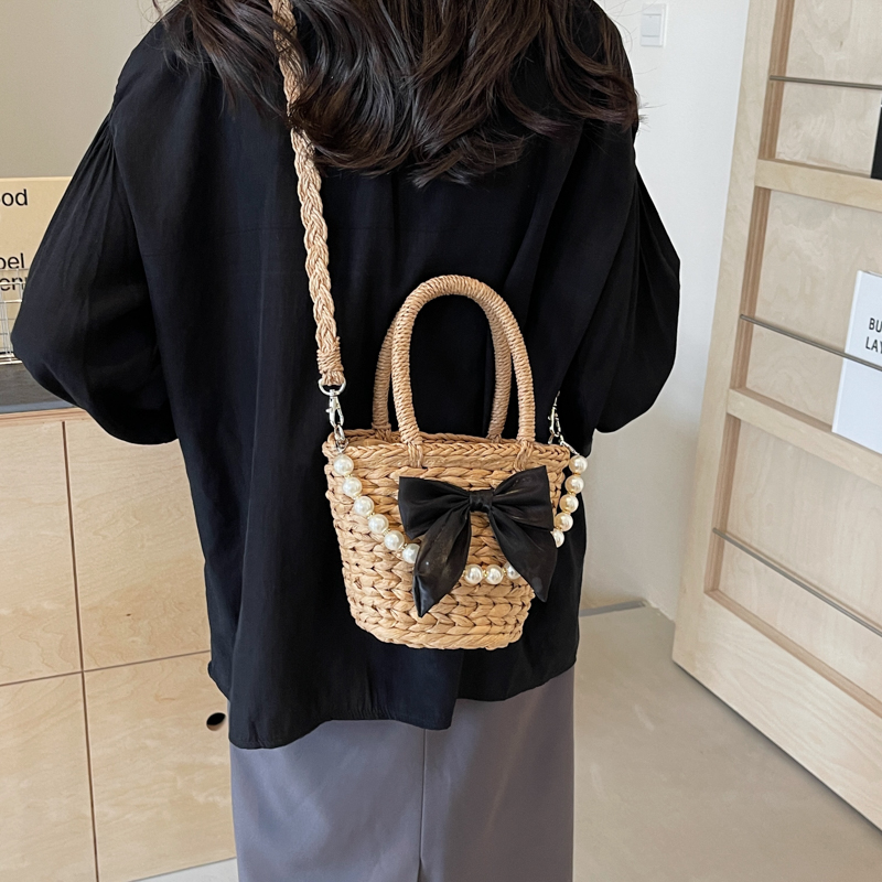 Women's Straw Solid Color Bow Knot Beach Weave Sewing Thread String Handbag Crossbody Bag Bucket Bag display picture 1