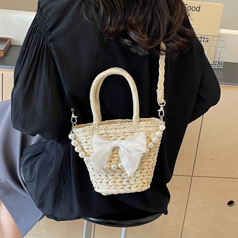Women's Straw Solid Color Bow Knot Beach Weave Sewing Thread String Handbag Crossbody Bag Bucket Bag display picture 3