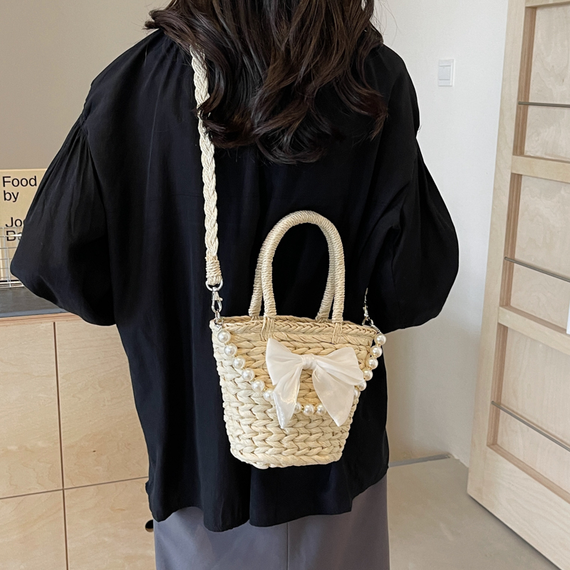 Women's Straw Solid Color Bow Knot Beach Weave Sewing Thread String Handbag Crossbody Bag Bucket Bag display picture 2
