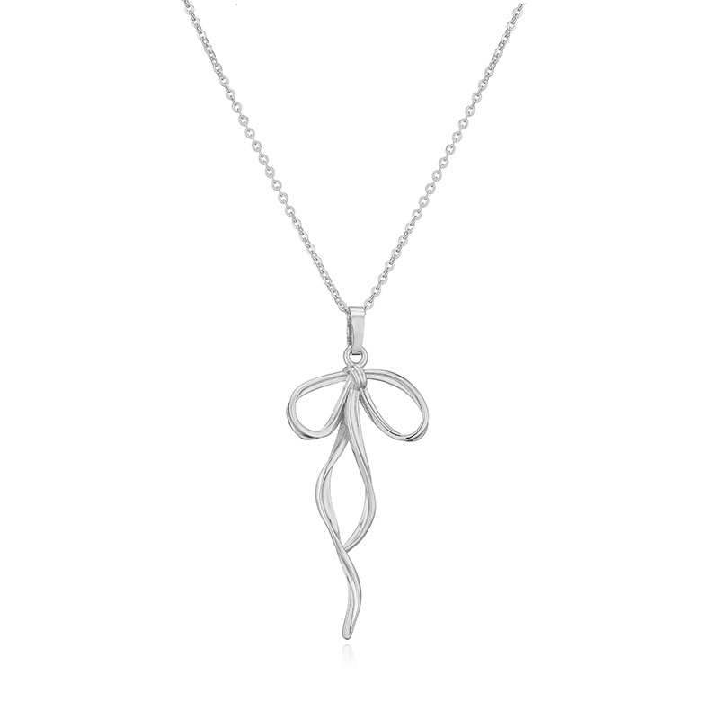 Le Cuivre Décontractée Élégant Style Simple Incruster Noeud D'Arc Perles Artificielles Zircon Pendentif display picture 11