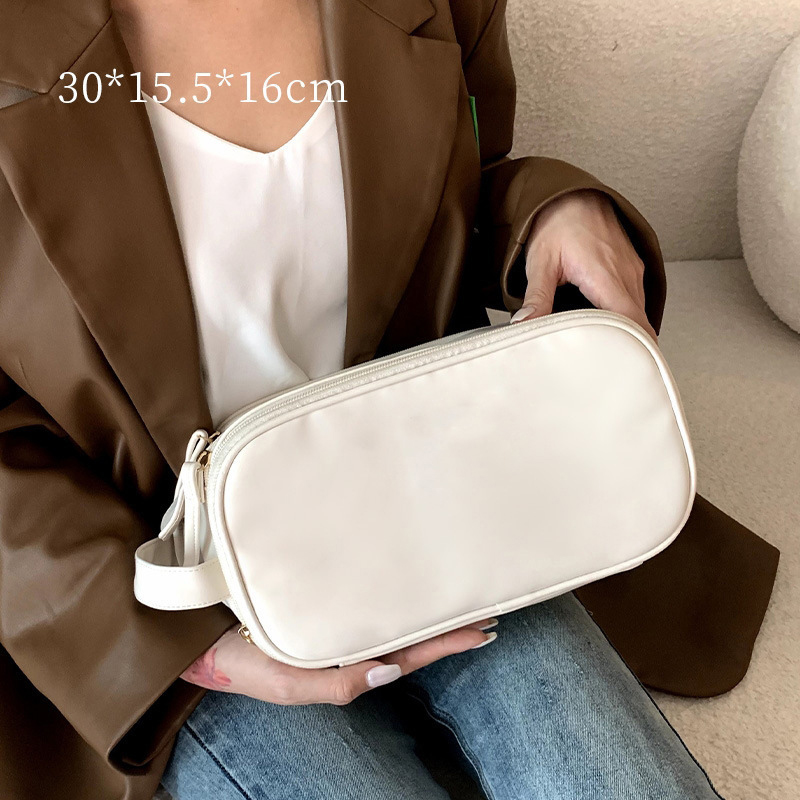 Women's Pu Leather Solid Color Classic Style Oval Zipper Cosmetic Bag Travel Bag Wash Bag display picture 5