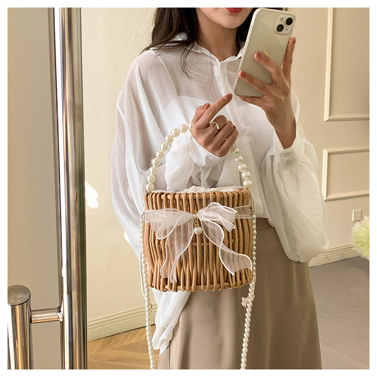Women's Small Rattan Solid Color Vacation Beach Pearls Weave Bowknot Cylindrical String Straw Bag display picture 5