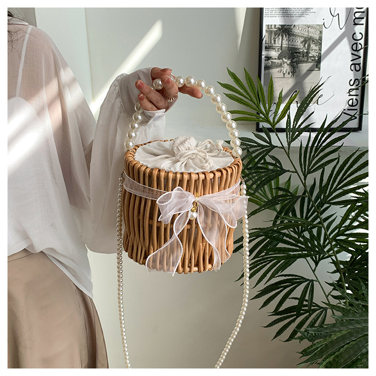 Women's Small Rattan Solid Color Vacation Beach Pearls Weave Bowknot Cylindrical String Straw Bag display picture 2